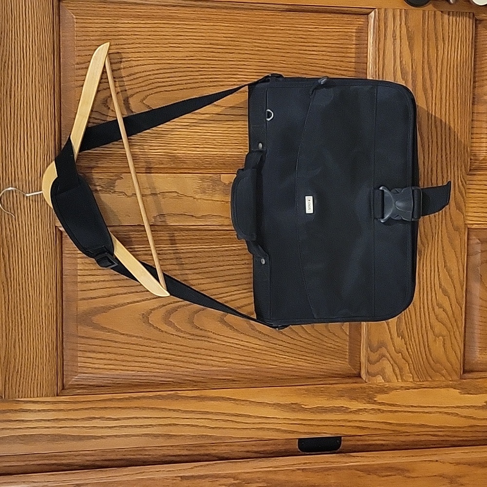 Solo black briefcase with a pullout sleeve for your laptop in black.
